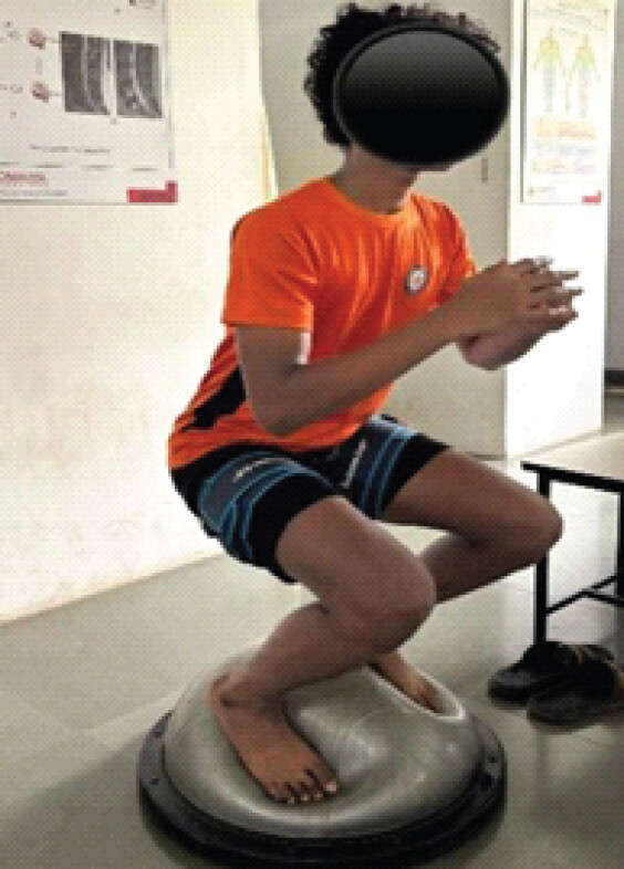 Figure 4: Blood flow restriction training - squats on BOSU ball.
